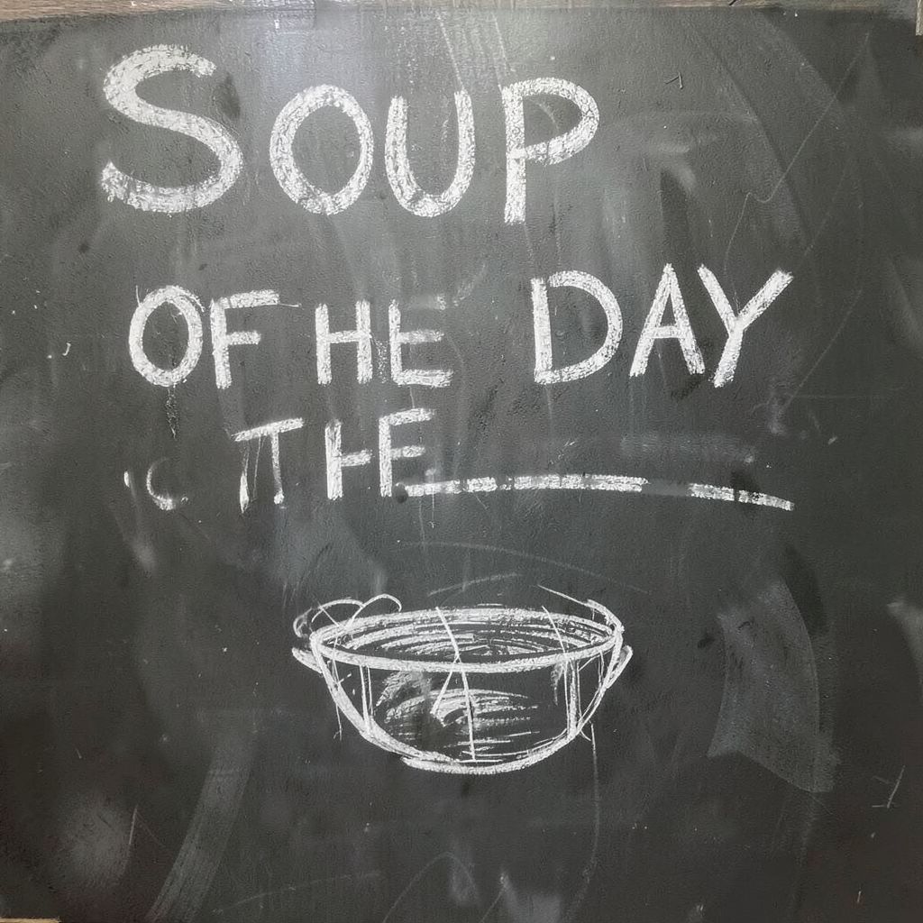 Private DiffusionのFlux.2 Klein 4B、QAD、プロンプト: A hand-lettered chalkboard menu reading 'SOUP OF THE DAY' with a small drawing of a bowl beneath